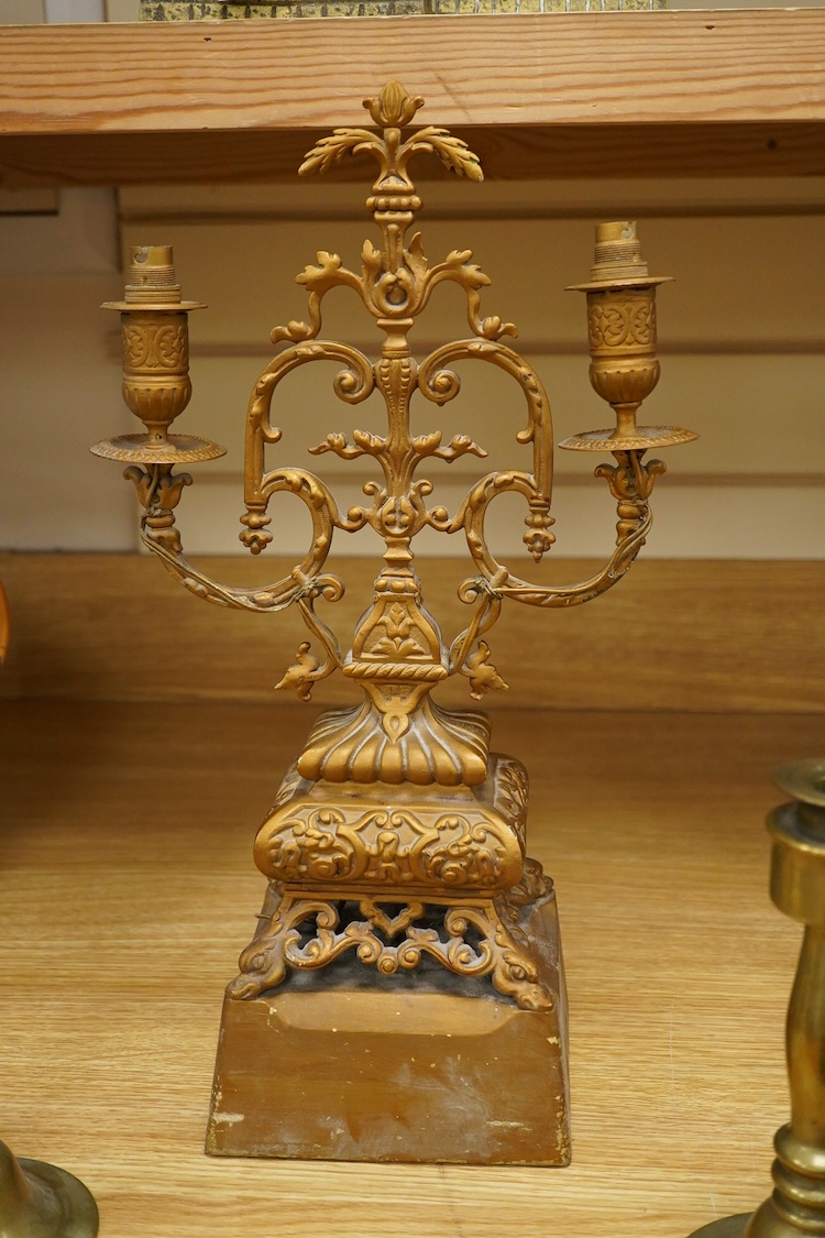 A pair of brass candlesticks and a gilt metal two branch gilt candelabrum, 45cm high